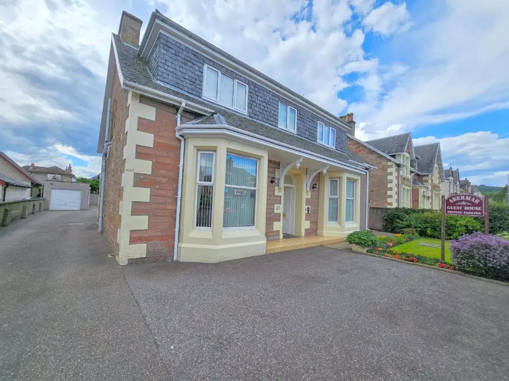 a house with a large driveway in front of it at mySTAYINN Abermar Guest House in Inverness