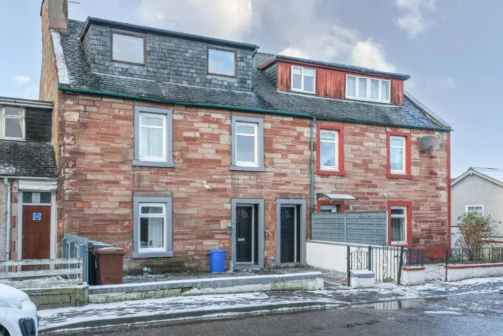 a red brick house with a black roof at mySTAYINN Telford Guest House in Inverness