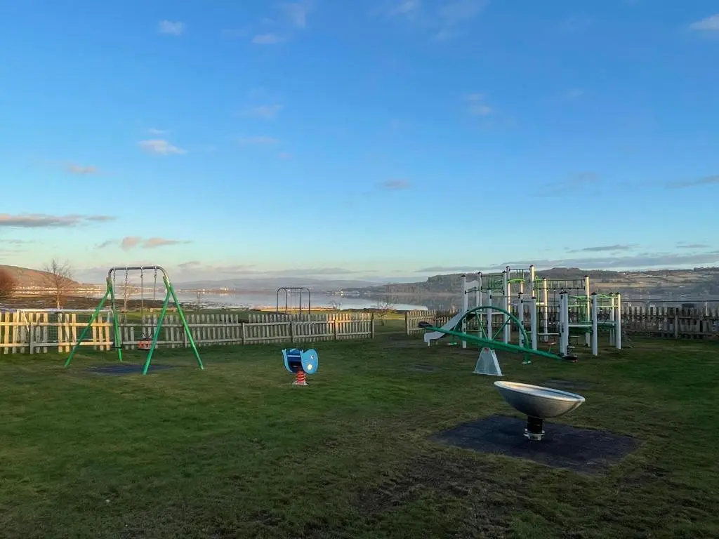 a park with a playground with a slide and a grill at Peaceful Sea View Home only 5 miles from Inverness in North Kessock
