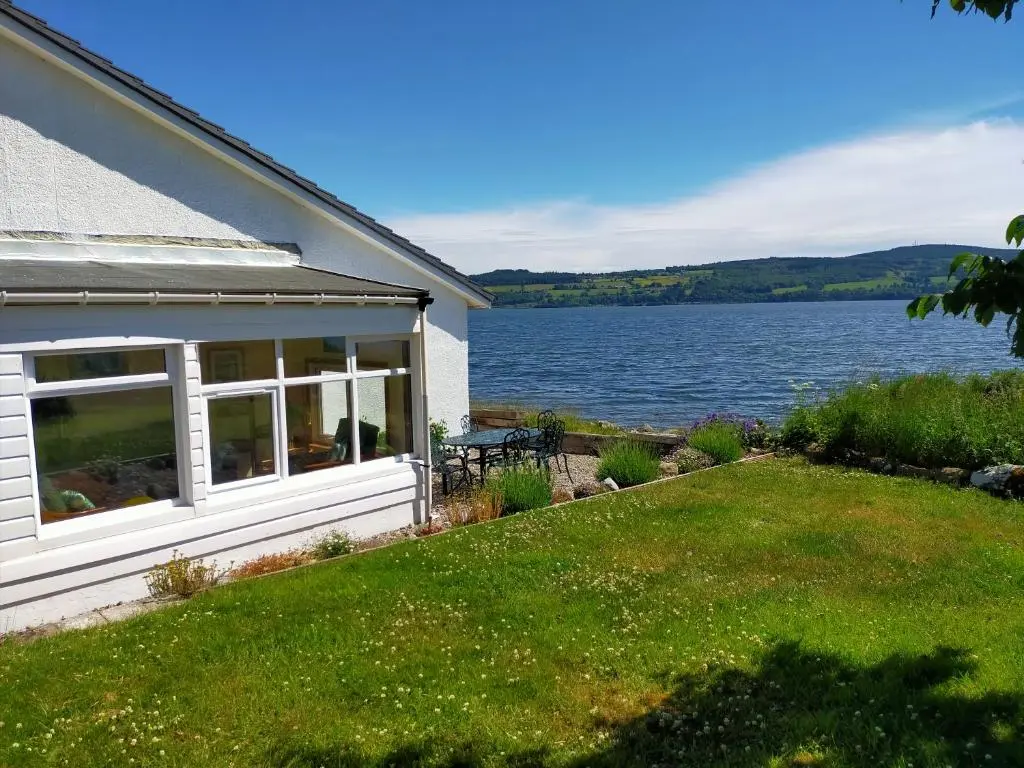 a house with a view of a lake at Peaceful Sea View Home only 5 miles from Inverness in North Kessock