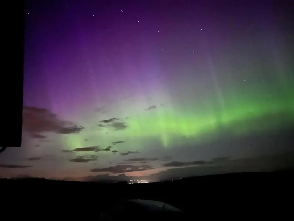 an image of the northern lights in the sky at Honeysuckle Straw Bale Cabin