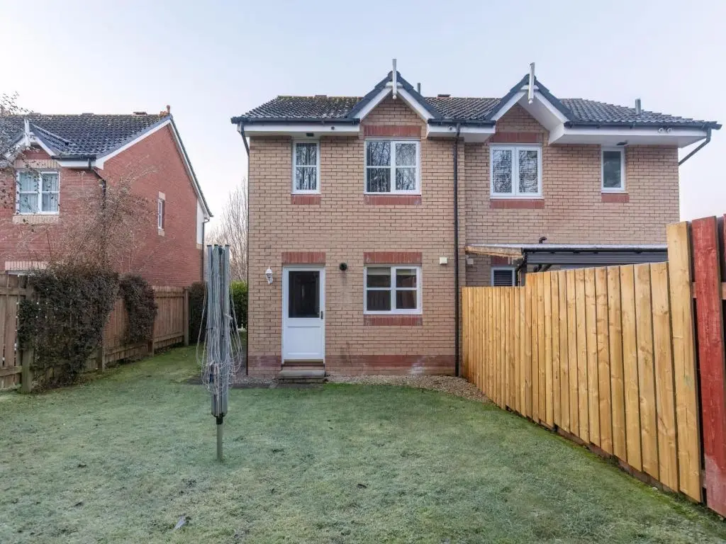 a house with a wooden fence and a gate at Villa Cedar House by Interhome in Inverness