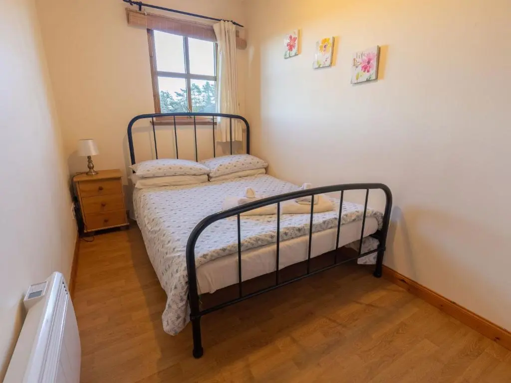 a bedroom with a bed and a window at Apartment Towerhill Heights by Interhome in Inverness