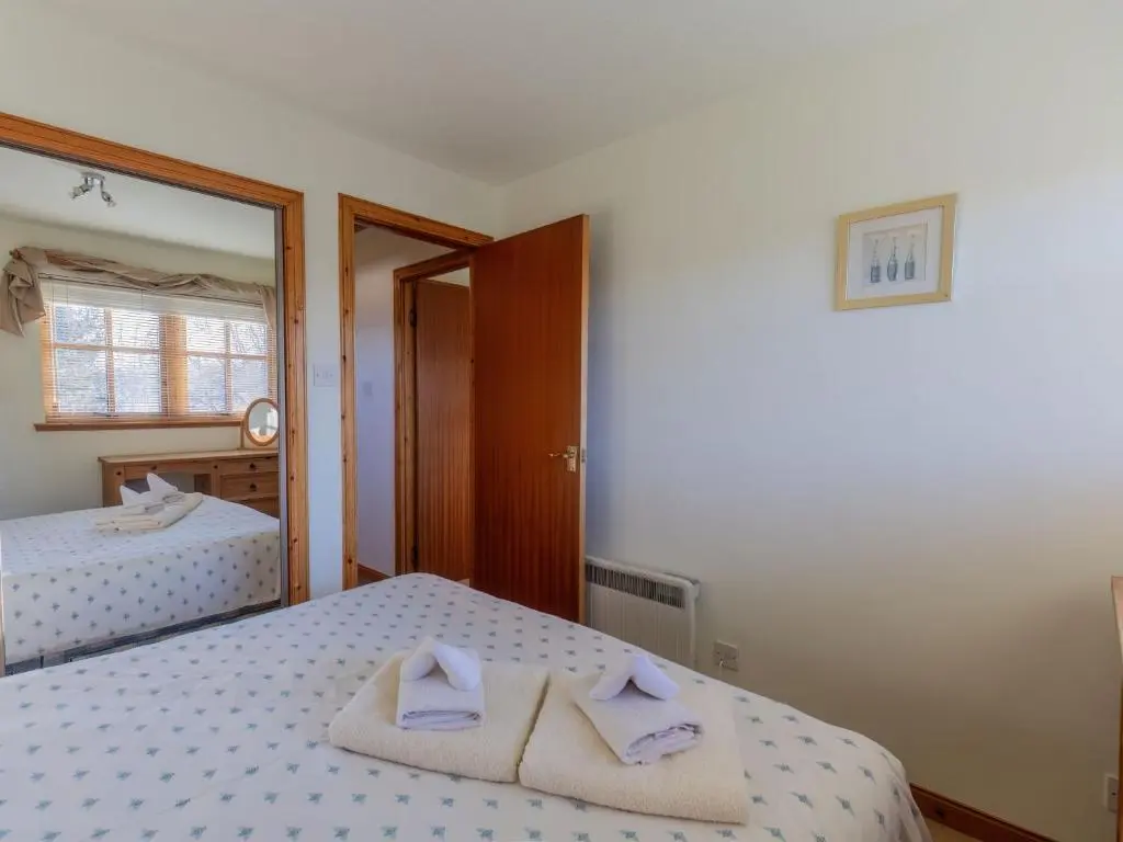 a bedroom with two beds with towels on them at Apartment Millar House by Interhome in Inverness