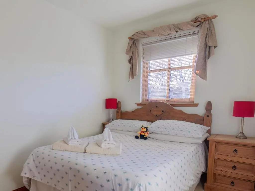a bedroom with two beds with a stuffed animal sitting on the bed at Apartment Millar House by Interhome in Inverness