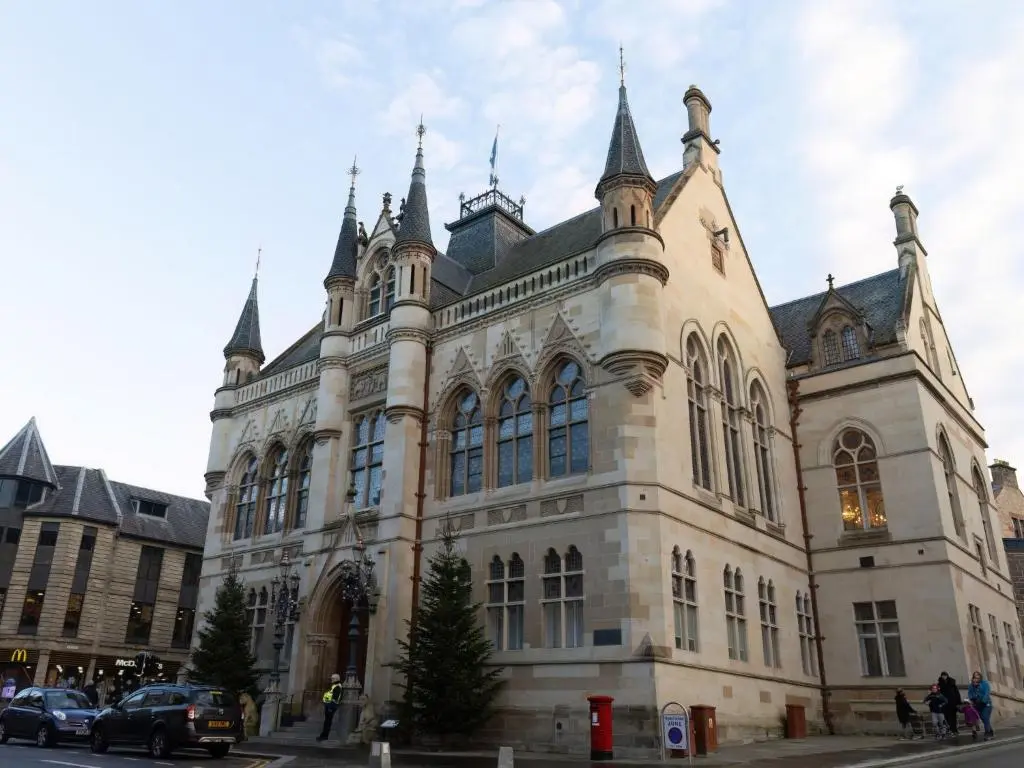 a large building with turrets on top of it at Apartment Old Edinburgh Cottage by Interhome in Inverness