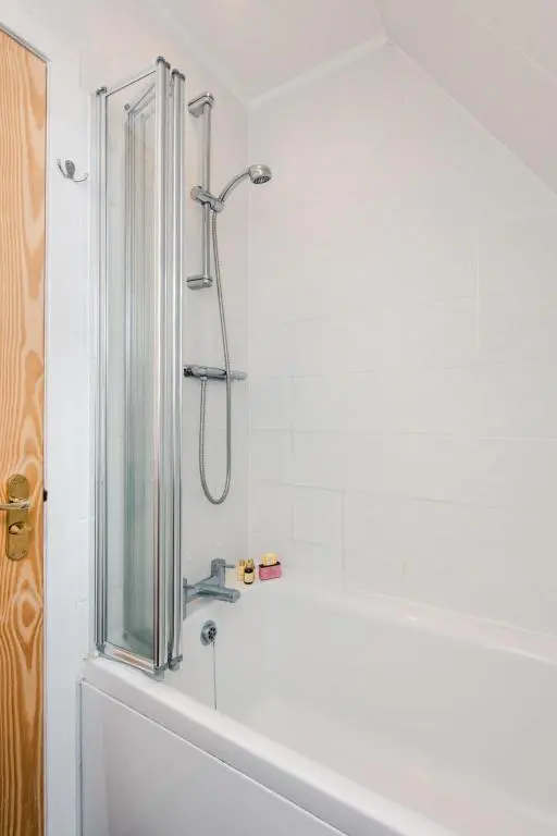 a bathroom with a shower and a bath tub at Chalet Rivendell by Interhome in Spean Bridge