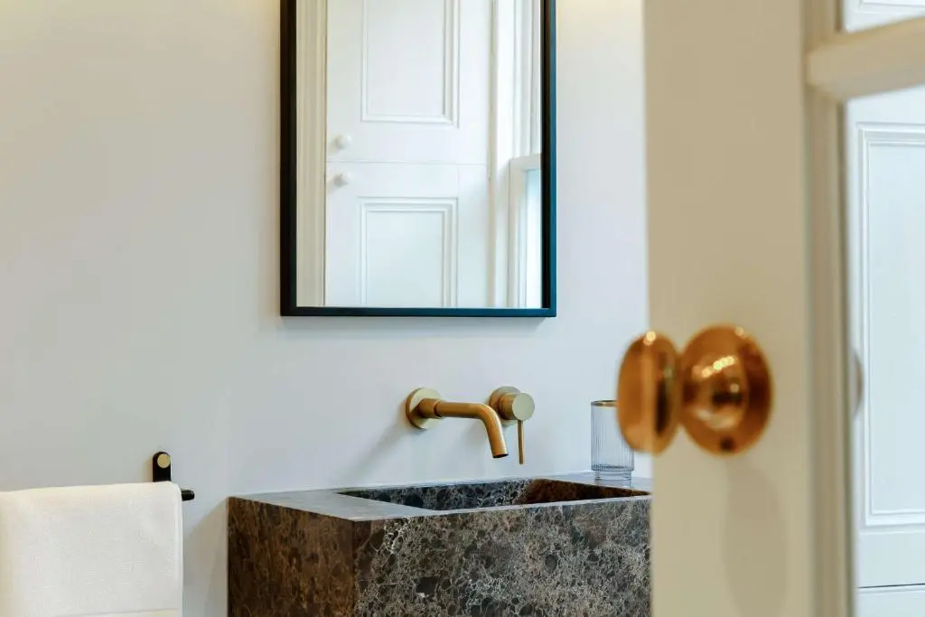 a bathroom with a sink and a mirror at Manar House Ground Floor Luxury Apartment in Inverurie