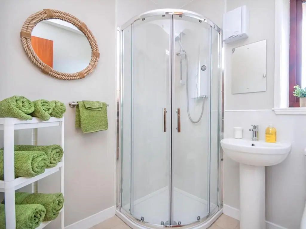 a bathroom with a shower and a sink at Strathy in Dornoch
