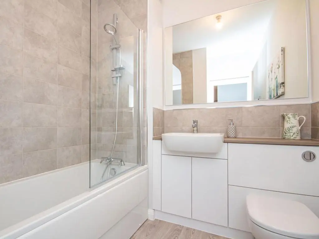 a bathroom with a sink and a toilet and a shower at Kessock View Apartment in Inshes