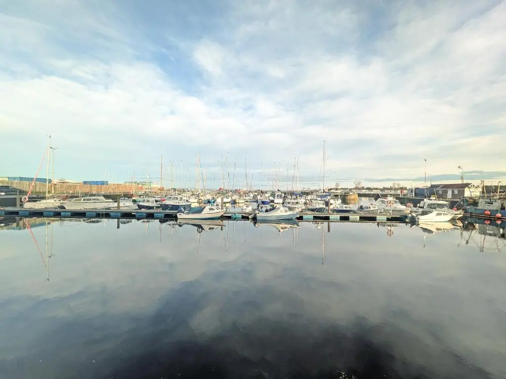 a bunch of boats are docked in a harbor at Reay House in Nairn