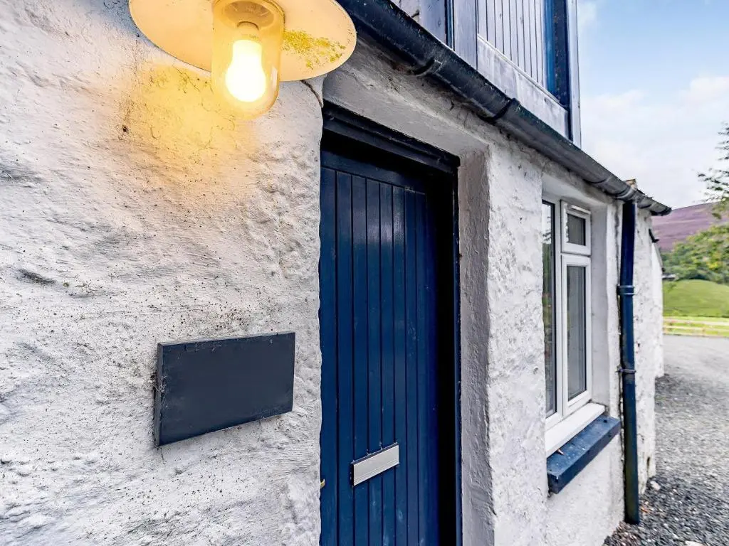 a blue door on the side of a building at 1 Bed in Blacklunans CA361 in Cray