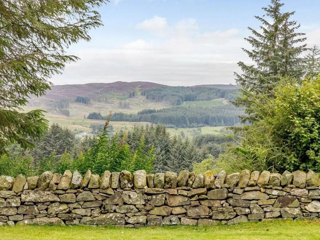 a stone wall with mountains in the background at 5 Bed in Blacklunans CA409 in Cray