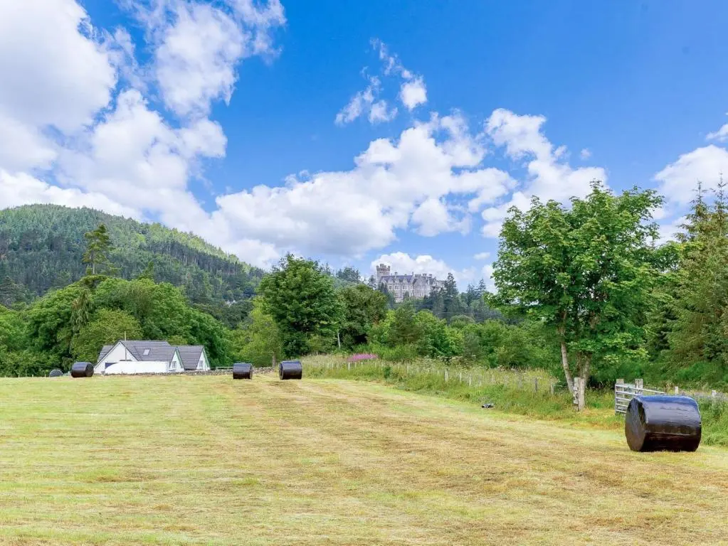 a field with barrels in the middle of a field at 1 Bed in Balblair 89058 in Culrain