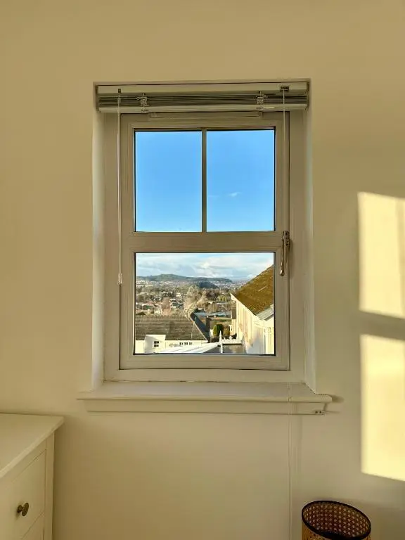 a window in a white room with a view at BraeView House in Inverness