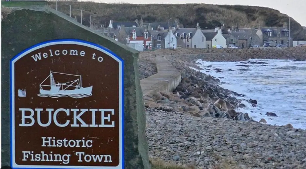 a sign for a bubbler fishing town next to a beach at Buckie Haven 3 Bed Contractors Business Travellers in Buckie