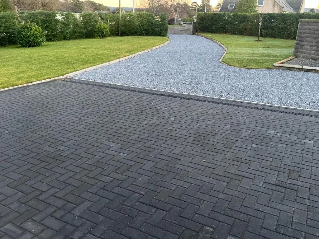 a brick walkway in a yard with grass at Beldorny in Kingston