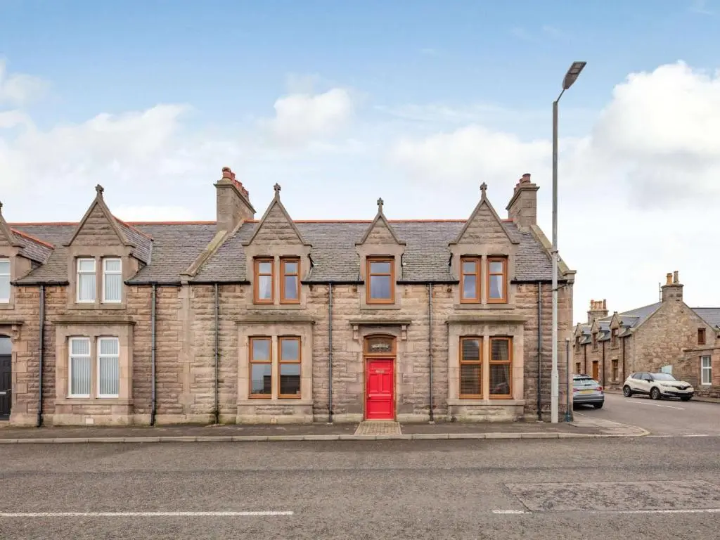 an old brick house with a red door at 3 Bed in Buckie 89824 in Buckie