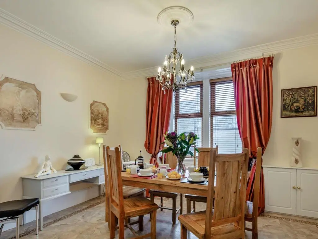 a dining room with a table and chairs at 3 Bed in Buckie 89824 in Buckie