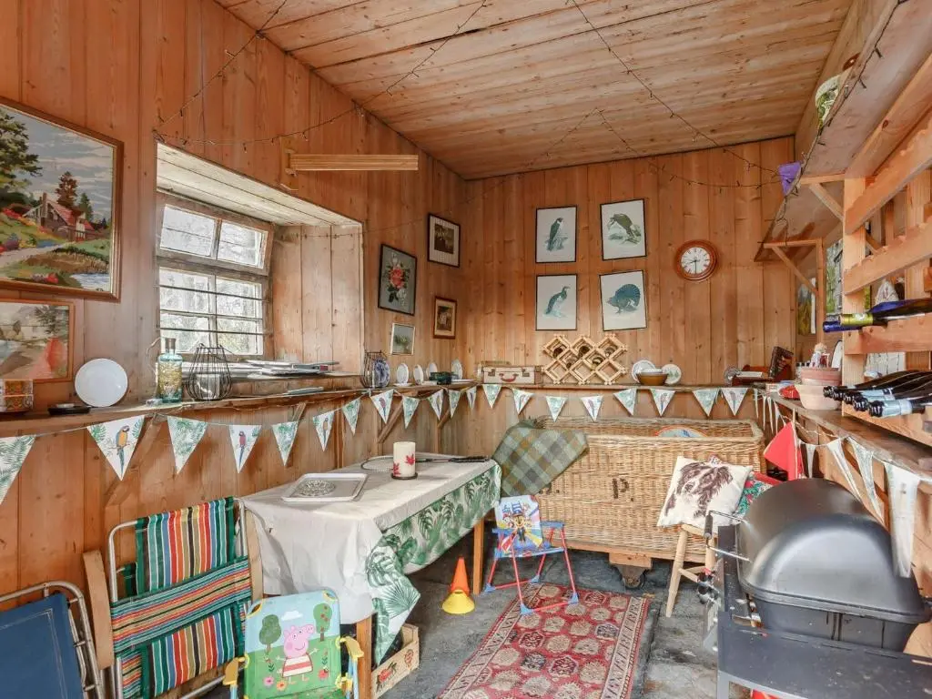 a kitchen with a table and chairs in a room at 4 Bed in Wick 91390 in Wick