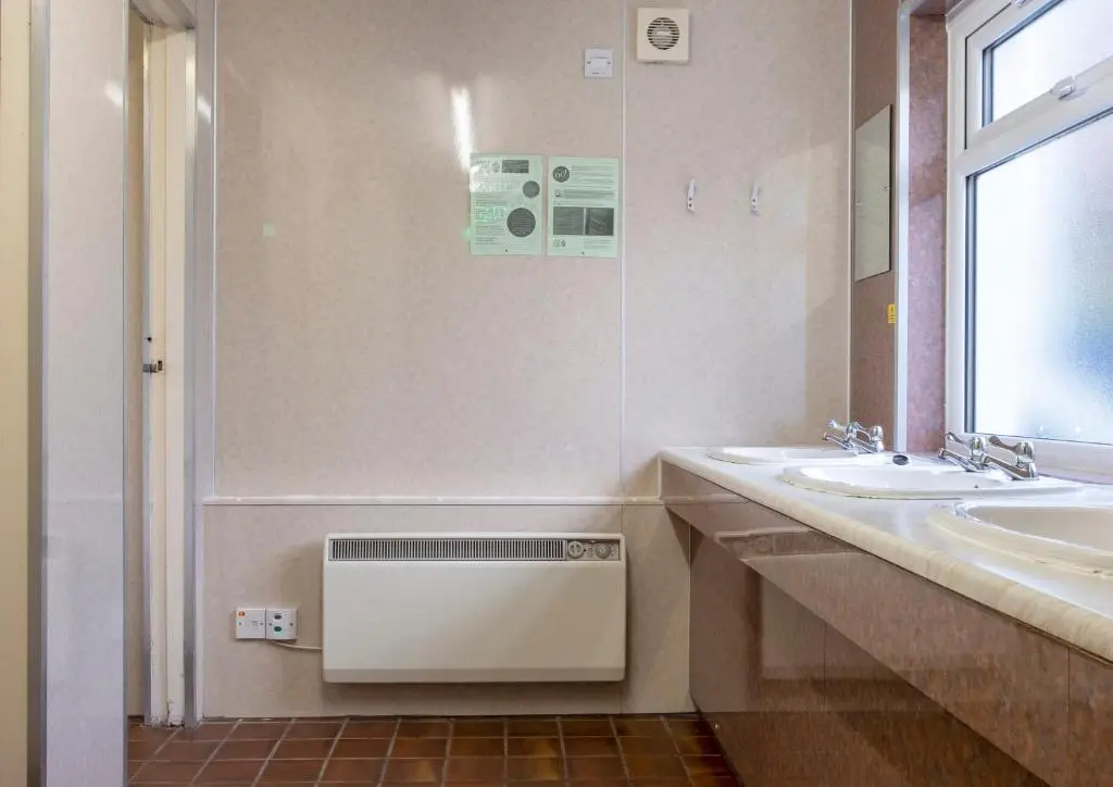 a bathroom with two sinks and a shower at Ullapool Youth Hostel in Ullapool