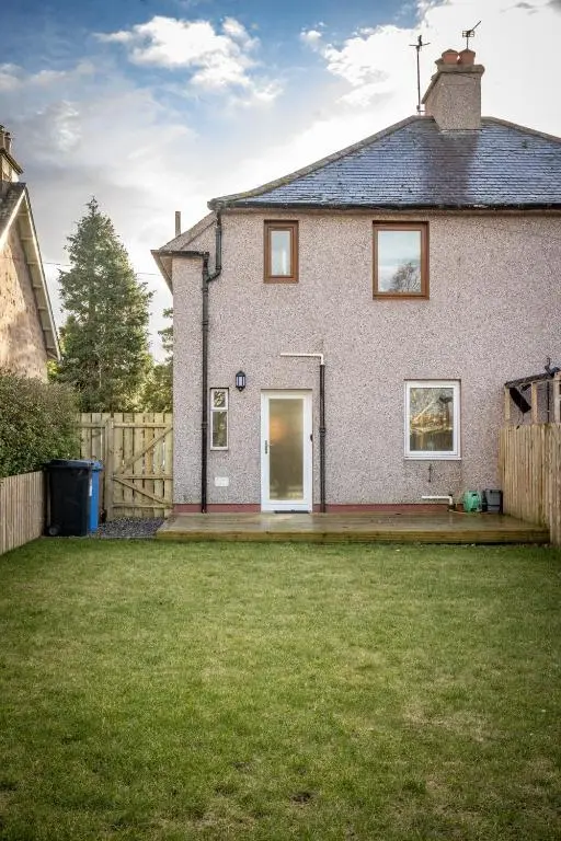 a house with a lawn in front of it at Ness at the Park in Inverness