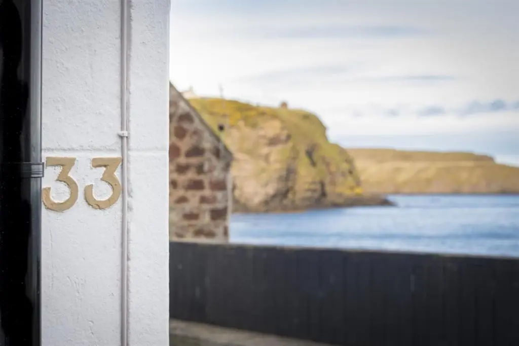 a door with the on the side of a building at The Wee House in Pennan