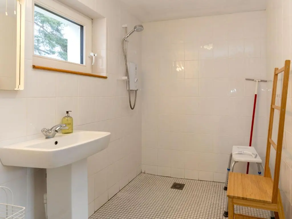 a bathroom with a sink and a shower at Holiday Home Muir Edge by Interhome in Nethy Bridge