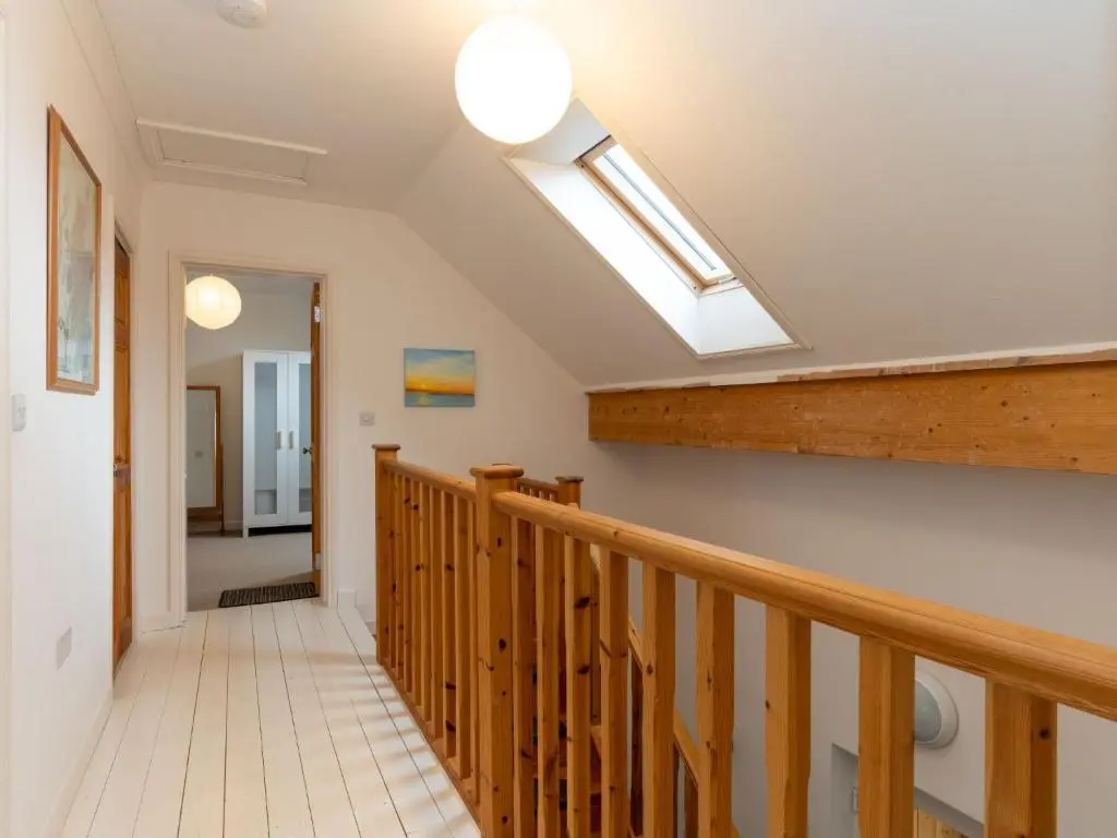 a staircase with a skylight in a house at Holiday Home Muir Edge by Interhome in Nethy Bridge