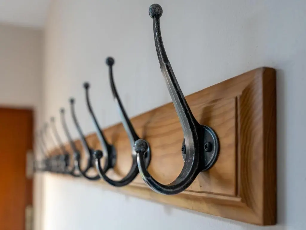a row of hangers on a wall at Apartment The Bruach by Interhome in Aviemore
