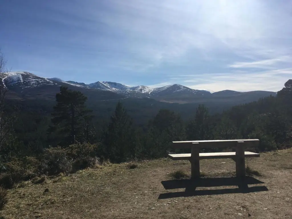 a bench sitting on top of a hill with mountains at Holiday Home Lower Curr by Interhome in Skye of Curr