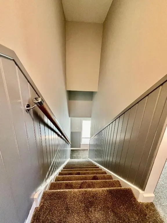 a hallway with stairs in a building at Argyle House Wick in Wick