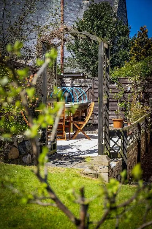 a garden with a table and a playground at Fonthill Bed and Breakfast Nairn in Nairn