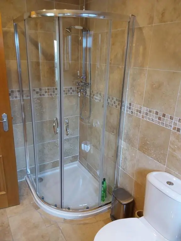 a shower stall in a bathroom with a toilet at Ceol Na Mara (Music of the Sea) in Rosemarkie