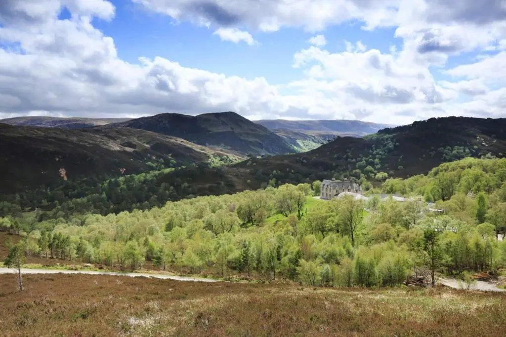 a view of a valley with trees and mountains at Caledonian Lodge in Croick