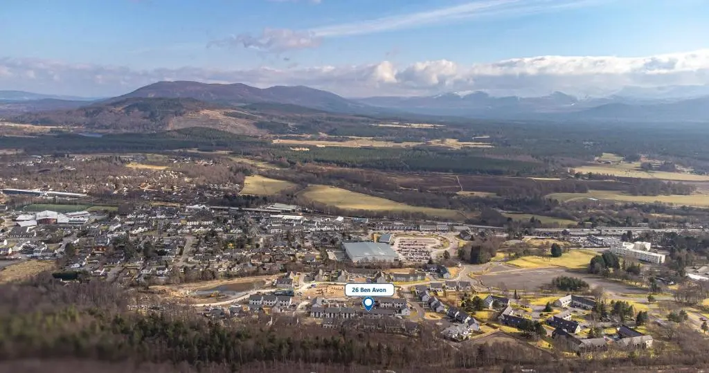 an aerial view of a town in the mountains at 26 Ben Avon in Aviemore