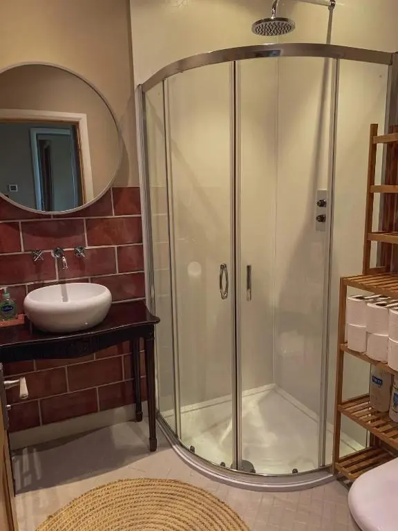a bathroom with a shower and a sink at Unique Highland in Inverness