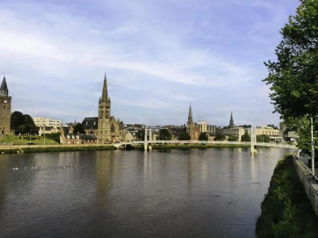 a bridge over a river in a city with buildings at Apartment Number 39 by Interhome in Inverness