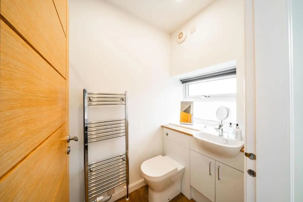 a bathroom with a toilet and a sink at The Corner House in Hopeman