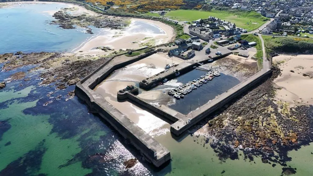 an aerial view of a pier next to a beach at The Corner House in Hopeman