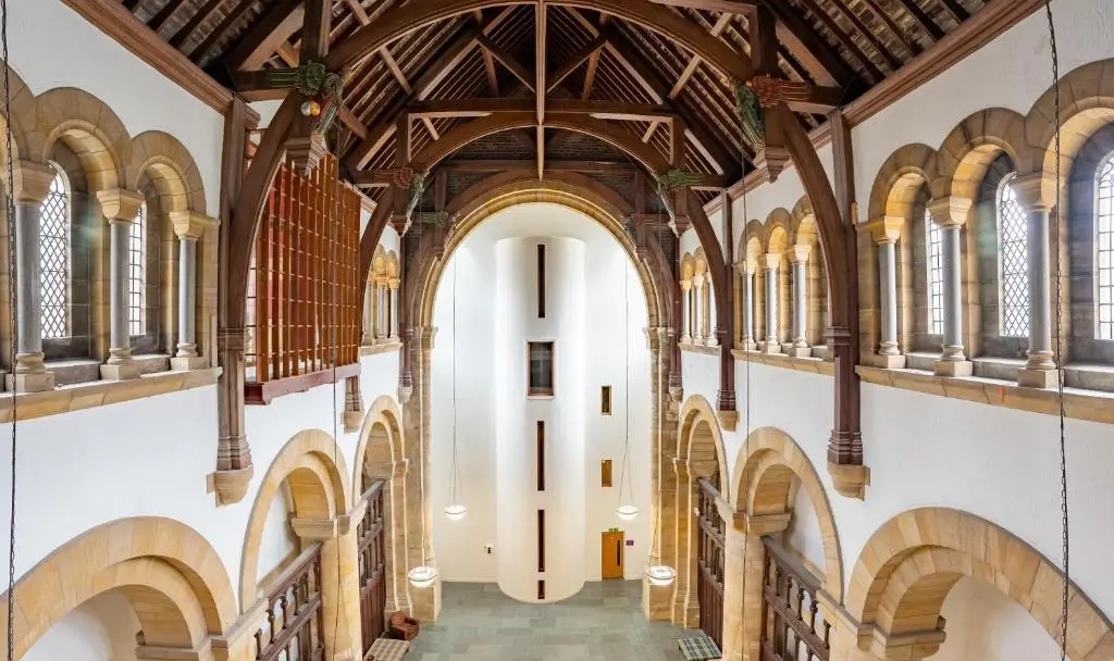 an empty hallway in a building with arched ceilings at Abbey Church Upper North Aisle Luxury Self Catering 2 bedroom Apartments in Fort Augustus