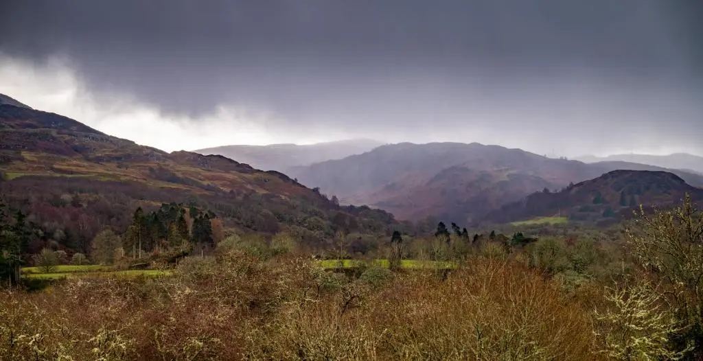 a view of a valley with mountains and trees at Abbey Church Upper North Aisle Luxury Self Catering 2 bedroom Apartments in Fort Augustus