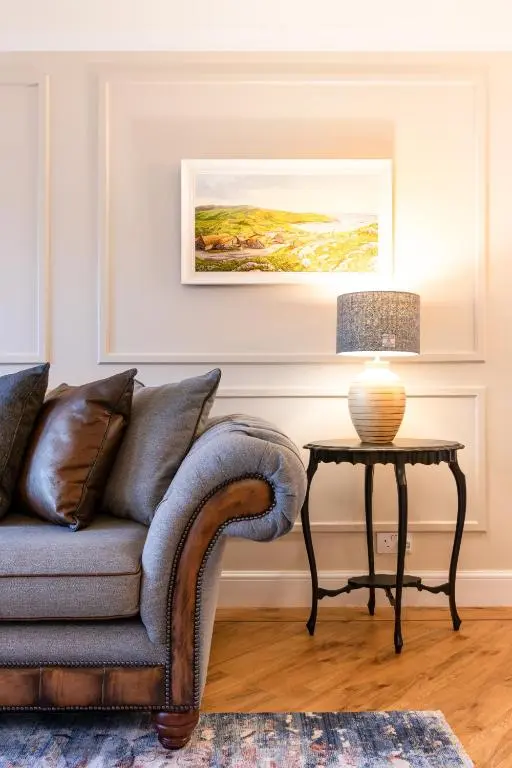 a living room with a couch and a table at Apartment 91 in Inverness