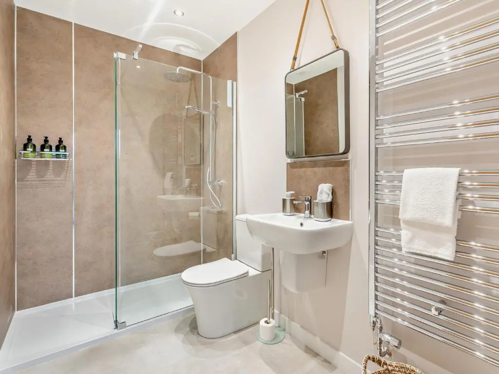 a bathroom with a toilet and a sink and a shower at 4 Bed in Dyce 93914 in Dyce