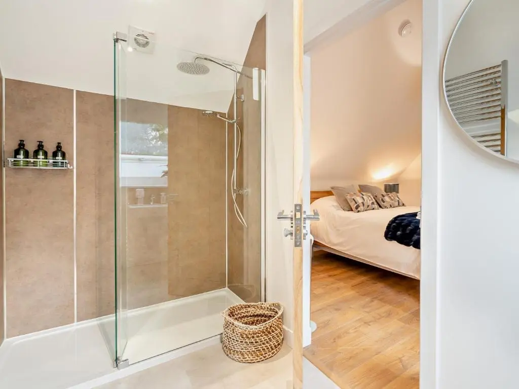 a bathroom with a shower and a bedroom at 4 Bed in Dyce 93914 in Dyce