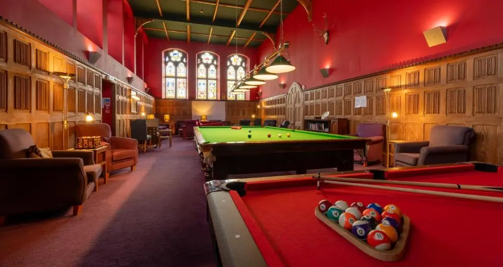 a billiard room with a pool table in a building at The Caledonian 3 Bedroom Self Catering Apartment in historic Abbey in Fort Augustus