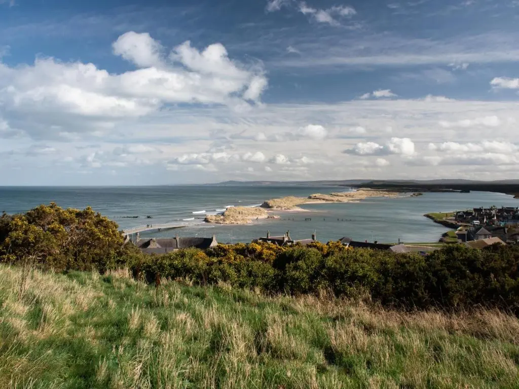 a view of a body of water with houses and buildings at Apartment Harbour Nights Deluxe 7A by Interhome in Lossiemouth