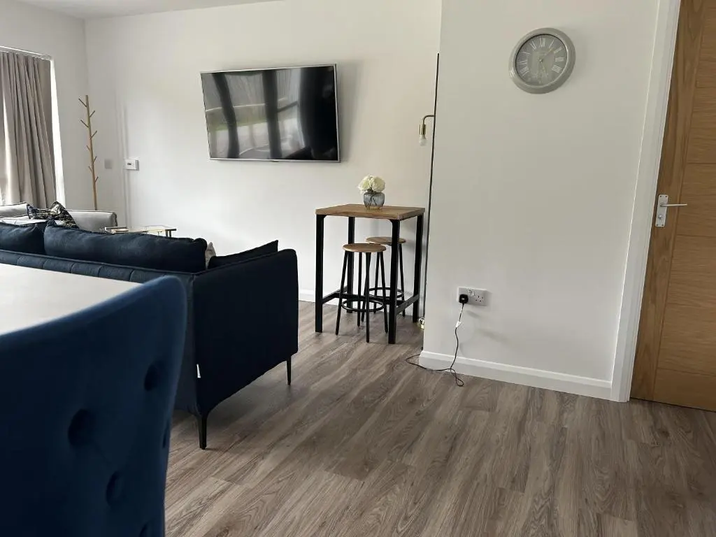 a living room with a couch and a table at 4 Guests - Inverness Highland Hideaway Nc500 in Inverness
