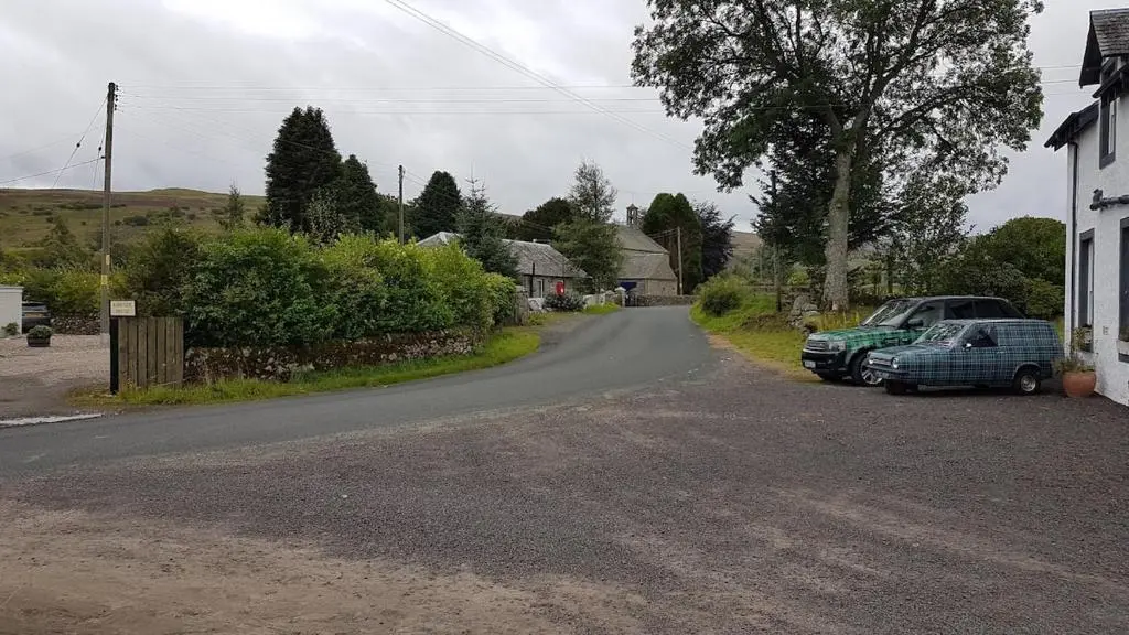 a street with cars parked on the side of a road at Glenisla Hotel in Blairgowrie