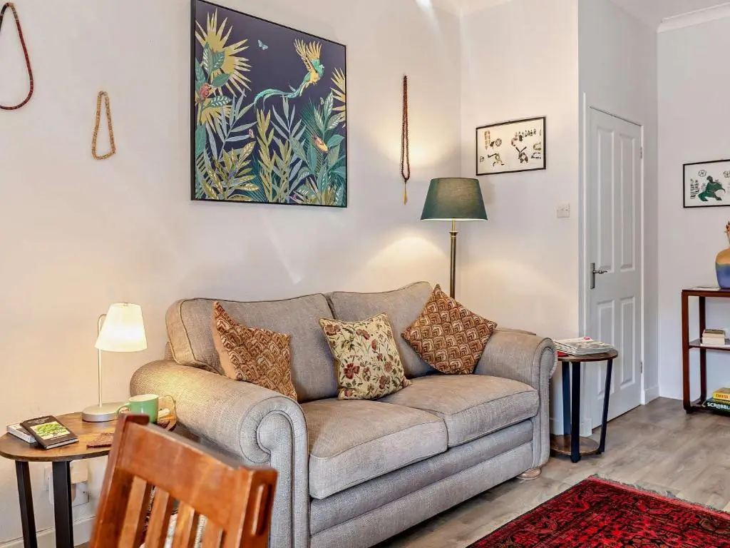 a living room with a couch and a table at 1 Bed in Cullen 94536 in Cullen